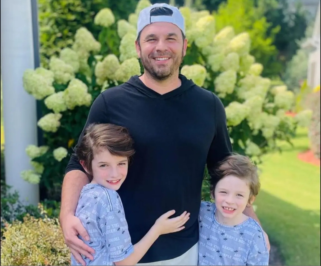 Coach Justin McTeer with his sons