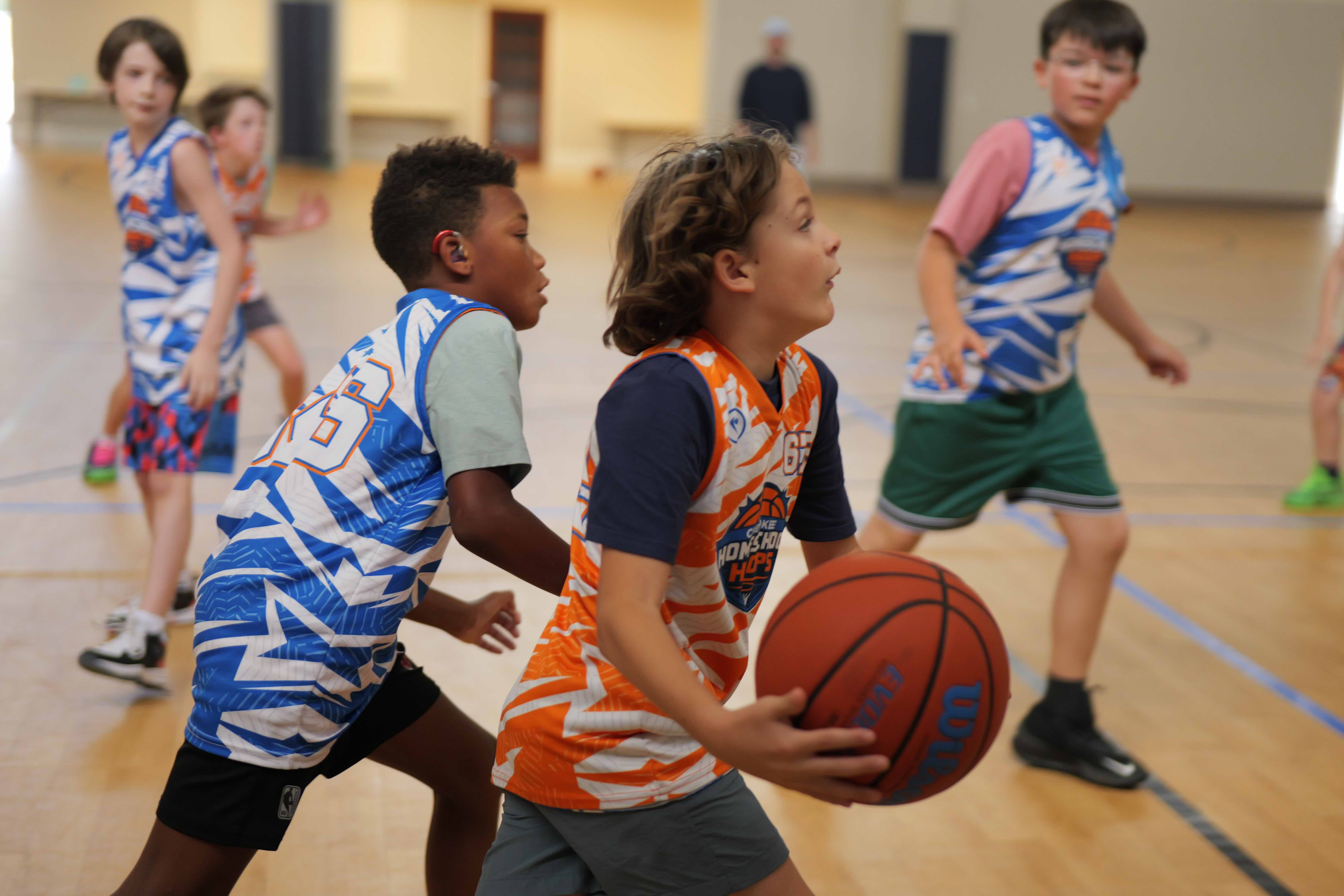 Elementary players competing in a Cherokee Homeschool Hoops game